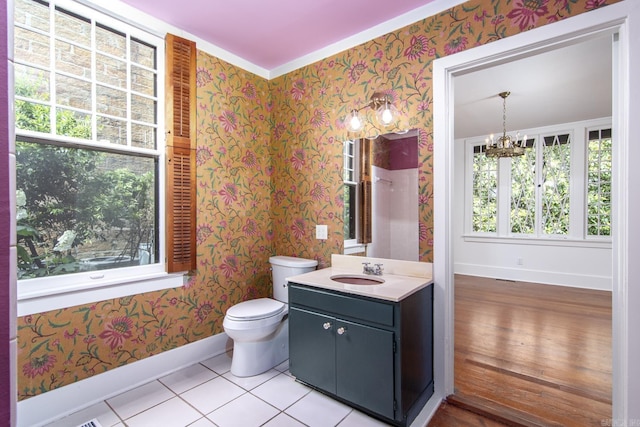 2108 Beechwood, Little Rock, AR 72207 - bathroom featuring baseboards, wallpapered walls, toilet, a chandelier, and vanity