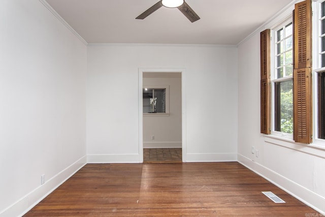 2108 Beechwood, Little Rock, AR 72207 - spare room featuring wood finished floors, ornamental molding, a ceiling fan, healthy amount of natural light, and baseboards