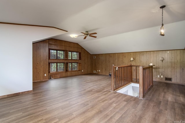 2108 Beechwood, Little Rock, AR 72207 - additional living space with wood walls, wood finished floors, lofted ceiling, a ceiling fan, and baseboards