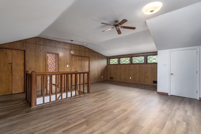 2108 Beechwood, Little Rock, AR 72207 - bonus room with wood walls, a ceiling fan, wood finished floors, vaulted ceiling, and baseboards