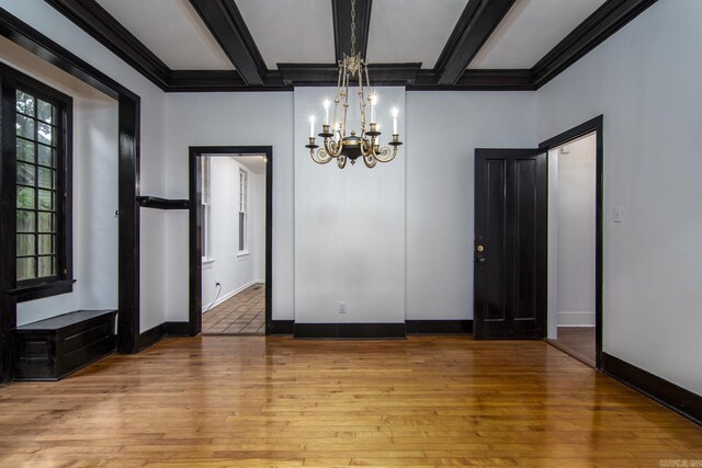 2108 Beechwood, Little Rock, AR 72207 - spare room with a chandelier, wood finished floors, baseboards, beamed ceiling, and coffered ceiling