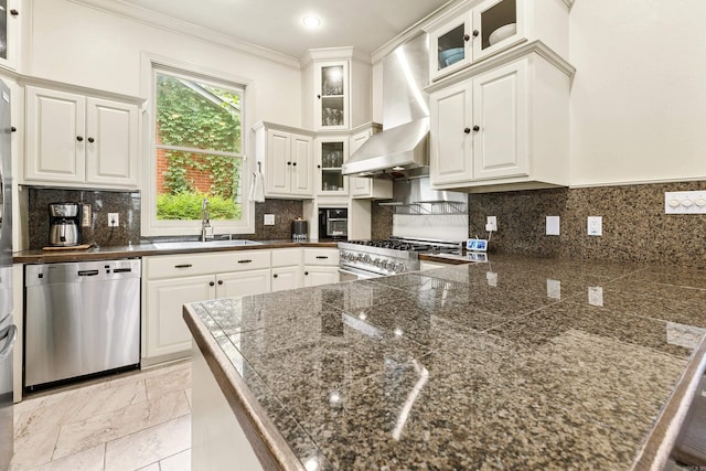 121 N Woodrow St, Little Rock, AR 72205 - kitchen featuring stainless steel dishwasher, wall chimney exhaust hood, gas range, a sink, and crown molding