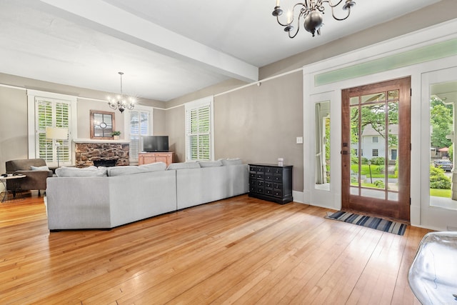 121 N Woodrow St, Little Rock, AR 72205 - living area featuring a chandelier, wood-type flooring, beamed ceiling, and plenty of natural light