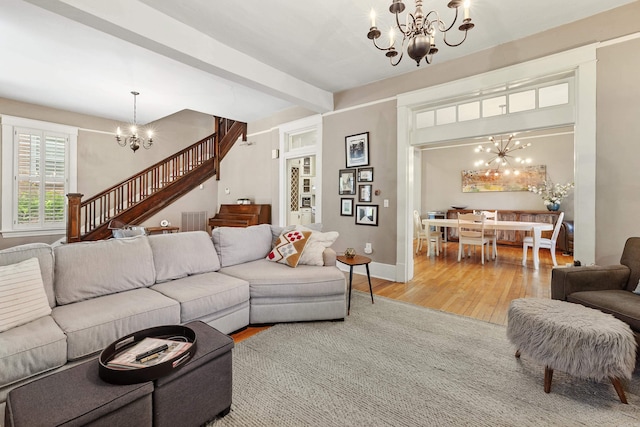 121 N Woodrow St, Little Rock, AR 72205 - living area with a chandelier, stairs, wood finished floors, beam ceiling, and baseboards