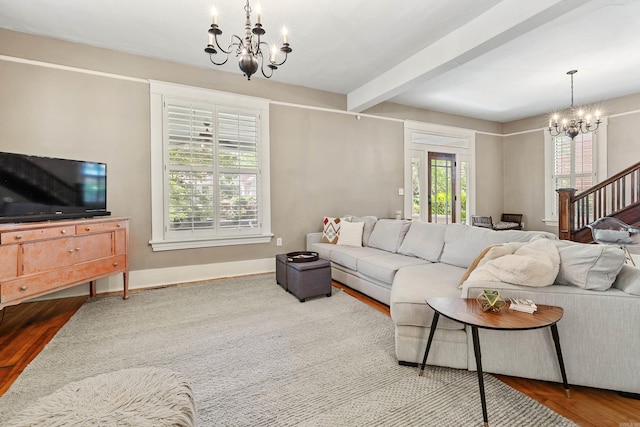 121 N Woodrow St, Little Rock, AR 72205 - living room with a chandelier, beam ceiling, wood finished floors, stairs, and baseboards