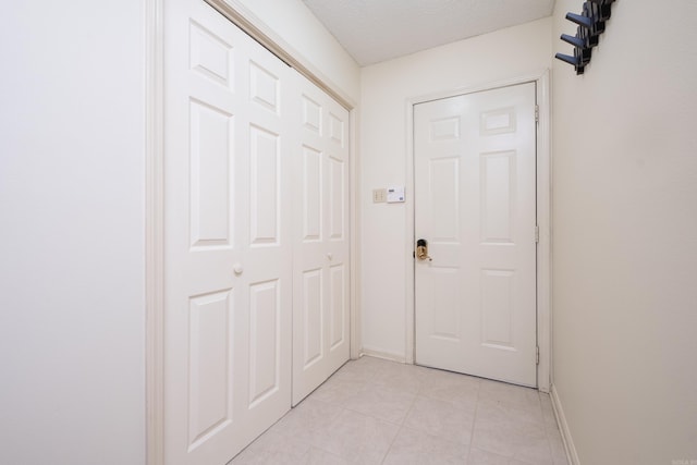 1505 Cherry Brook Dr, Little Rock, AR 72211 - entryway featuring baseboards and light tile patterned flooring