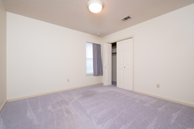 1505 Cherry Brook Dr, Little Rock, AR 72211 - unfurnished bedroom featuring carpet floors, baseboards, and a textured ceiling