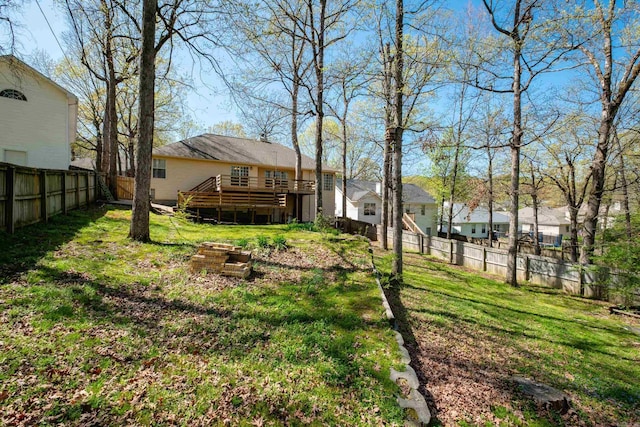 1505 Cherry Brook Dr, Little Rock, AR 72211 - view of yard featuring a deck and a fire pit