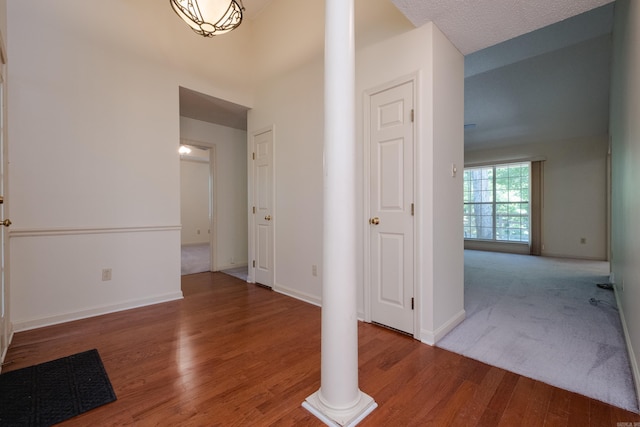 1505 Cherry Brook Dr, Little Rock, AR 72211 - foyer featuring decorative columns, wood finished floors, and baseboards
