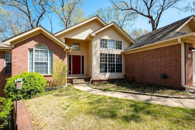 1505 Cherry Brook Dr, Little Rock, AR 72211 - view of front of property featuring brick siding and a front lawn