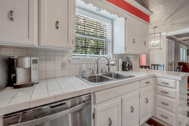 77 Stoneledge Dr, Maumelle, AR 72113 - kitchen with a sink, stainless steel dishwasher, tile countertops, white cabinetry, and a textured ceiling