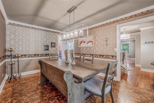 77 Stoneledge Dr, Maumelle, AR 72113 - dining space with wallpapered walls, crown molding, wood finished floors, a textured ceiling, and baseboards