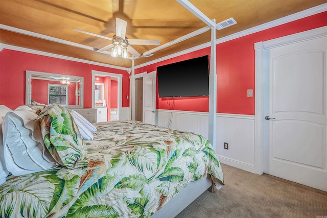 77 Stoneledge Dr, Maumelle, AR 72113 - carpeted bedroom with a wainscoted wall, ornamental molding, connected bathroom, and a ceiling fan