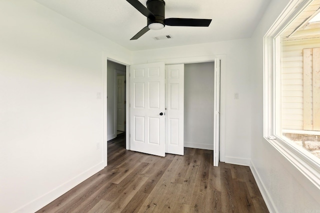 13512 Peters Rd, Cabot, AR 72023 - unfurnished bedroom with baseboards, wood finished floors, ceiling fan, and a closet