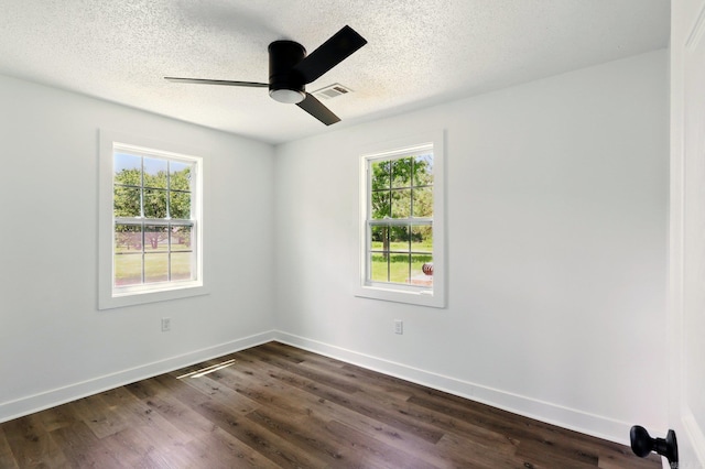 13512 Peters Rd, Cabot, AR 72023 - spare room with healthy amount of natural light, ceiling fan, a textured ceiling, dark wood-type flooring, and baseboards