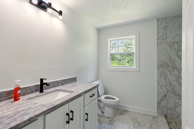 13512 Peters Rd, Cabot, AR 72023 - bathroom featuring marble finish flooring, vanity, toilet, a textured ceiling, and baseboards