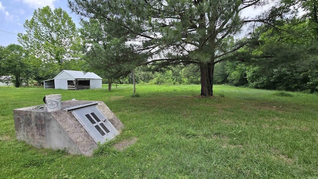 13512 Peters Rd, Cabot, AR 72023 - view of green lawn featuring an outbuilding and an outdoor structure