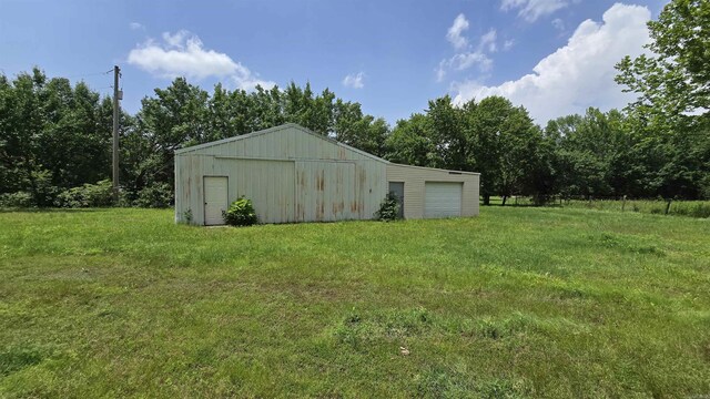 13512 Peters Rd, Cabot, AR 72023 - view of pole building featuring a lawn