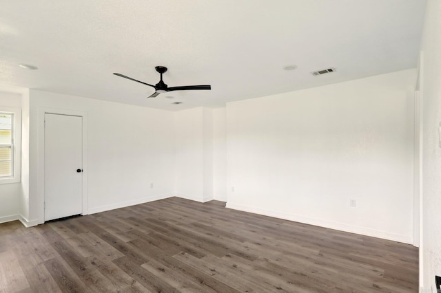 13512 Peters Rd, Cabot, AR 72023 - empty room with dark wood finished floors, ceiling fan, and baseboards