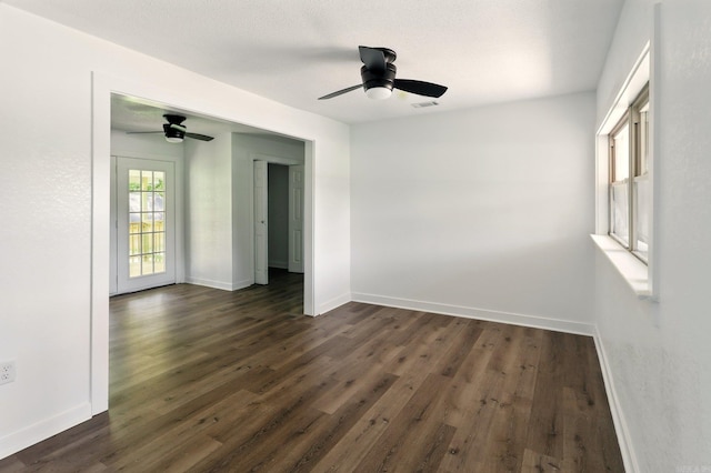 13512 Peters Rd, Cabot, AR 72023 - spare room featuring dark wood-style floors, baseboards, and ceiling fan