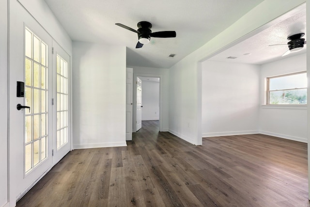 13512 Peters Rd, Cabot, AR 72023 - unfurnished room with a ceiling fan, dark wood-style flooring, and baseboards