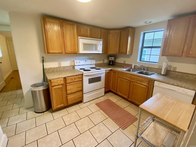 816 N Polk, Little Rock, AR 72205 - kitchen featuring white appliances, a sink, light tile patterned floors, and light countertops