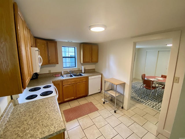 816 N Polk, Little Rock, AR 72205 - kitchen featuring white appliances, a sink, light tile patterned floors, brown cabinetry, and light countertops