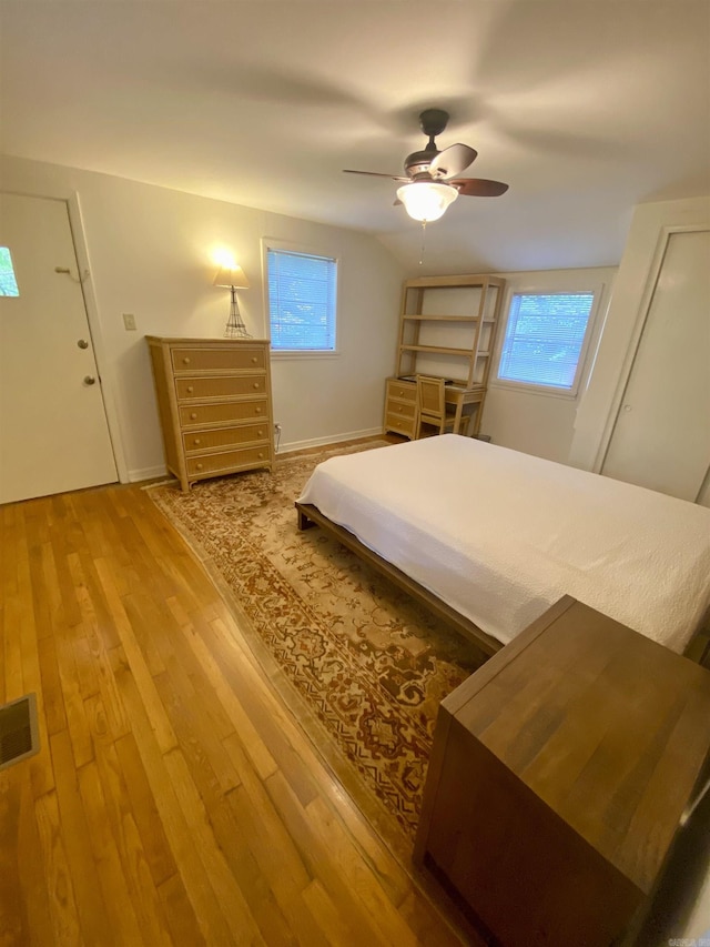 816 N Polk, Little Rock, AR 72205 - bedroom with wood finished floors, multiple windows, a ceiling fan, and baseboards