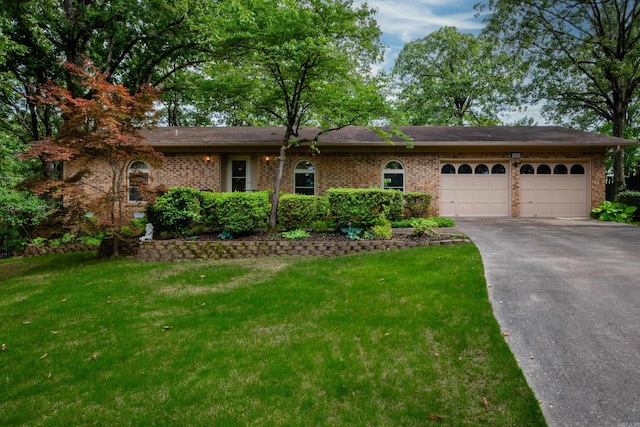 1312 Winnebago Dr, North Little Rock, AR 72116 - ranch-style home featuring a garage, driveway, a front lawn, and brick siding