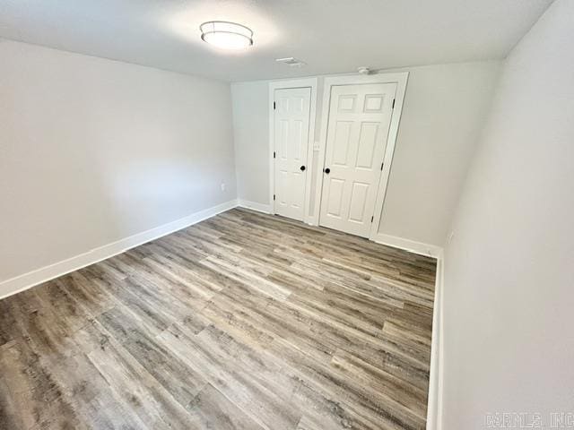 1307 Aplin Ave, Perryville, AR 72126 - unfurnished bedroom with wood finished floors, baseboards, and a closet