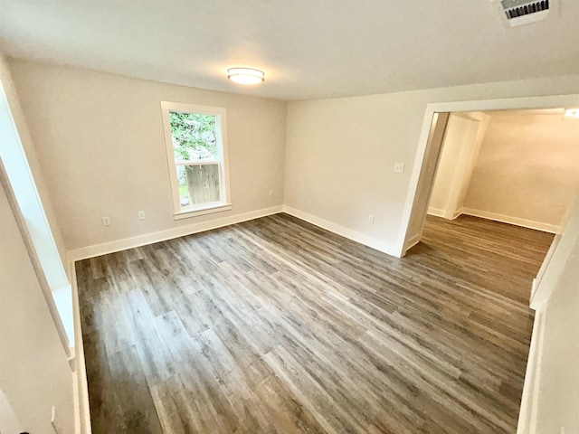 1307 Aplin Ave, Perryville, AR 72126 - unfurnished room featuring dark wood finished floors and baseboards