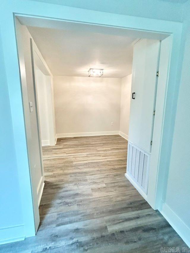1307 Aplin Ave, Perryville, AR 72126 - corridor featuring wood finished floors and baseboards