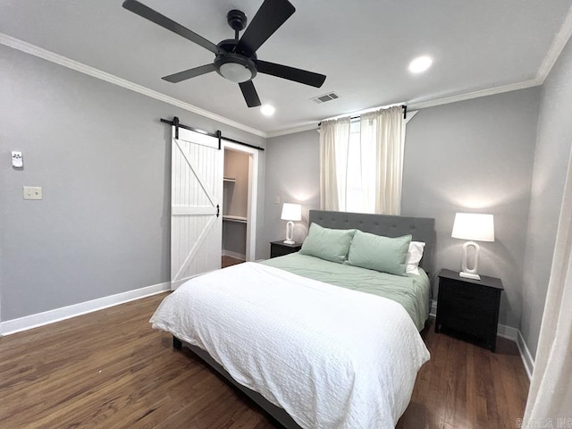 1701 N University, Little Rock, AR 72207 - bedroom with a barn door, baseboards, wood finished floors, ornamental molding, and a ceiling fan