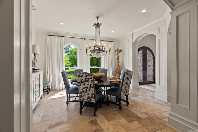 64 Sologne Cir, Little Rock, AR 72223 - dining area featuring arched walkways, stone tile floors, ornamental molding, a chandelier, and recessed lighting