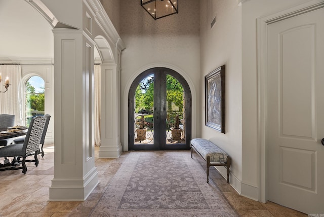 64 Sologne Cir, Little Rock, AR 72223 - entrance foyer featuring decorative columns, french doors, arched walkways, and a high ceiling