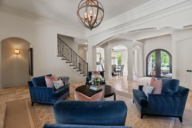 64 Sologne Cir, Little Rock, AR 72223 - living room featuring arched walkways, decorative columns, a chandelier, ornamental molding, and stone tile flooring