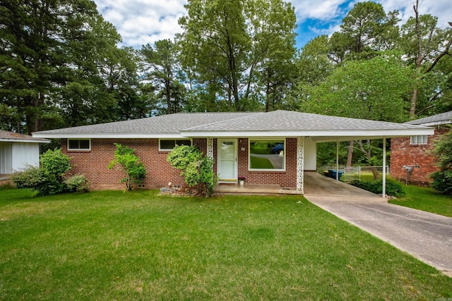 25 Barbara Cir, Little Rock, AR 72204 - ranch-style house featuring concrete driveway, a front lawn, a carport, brick siding, and a shingled roof
