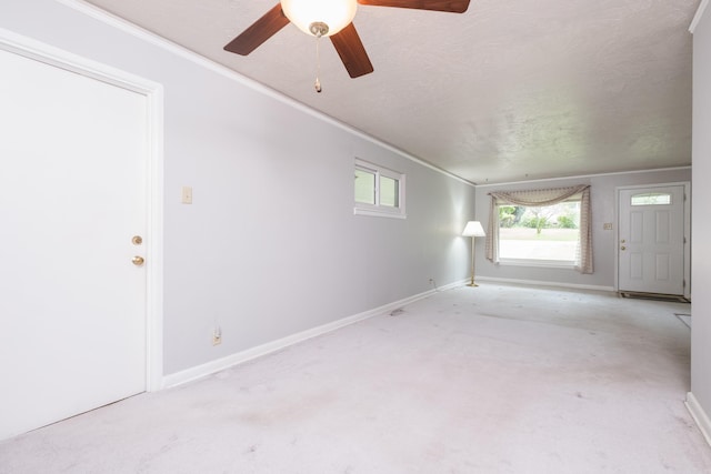 25 Barbara Cir, Little Rock, AR 72204 - unfurnished living room featuring ornamental molding, a ceiling fan, baseboards, and light carpet