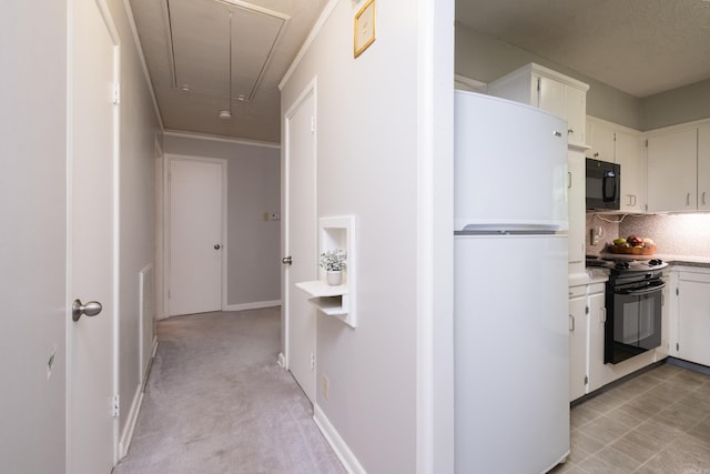25 Barbara Cir, Little Rock, AR 72204 - kitchen with black appliances, light countertops, decorative backsplash, and white cabinetry