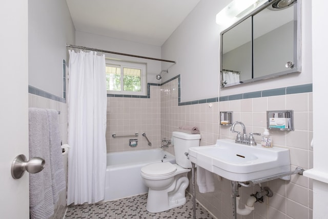 25 Barbara Cir, Little Rock, AR 72204 - bathroom with tile walls, toilet, shower / tub combo, and a wainscoted wall