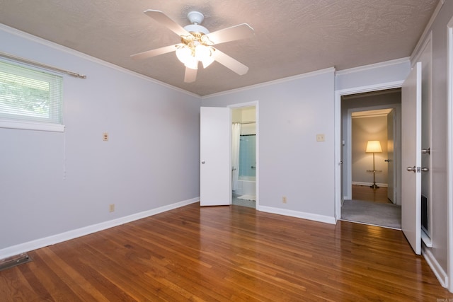 25 Barbara Cir, Little Rock, AR 72204 - unfurnished bedroom with wood finished floors, baseboards, a textured ceiling, crown molding, and ensuite bath