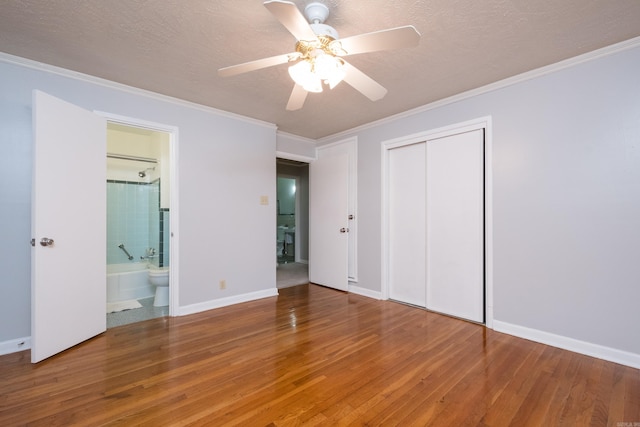 25 Barbara Cir, Little Rock, AR 72204 - unfurnished bedroom with wood-type flooring, a closet, ornamental molding, baseboards, and a ceiling fan
