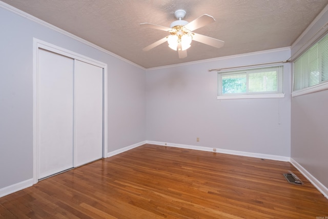 25 Barbara Cir, Little Rock, AR 72204 - unfurnished bedroom with wood finished floors, baseboards, ornamental molding, a ceiling fan, and a closet