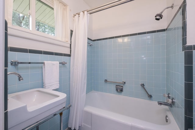 25 Barbara Cir, Little Rock, AR 72204 - full bathroom featuring shower / bath combo, a sink, and tile walls