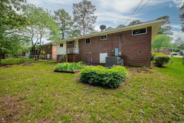 25 Barbara Cir, Little Rock, AR 72204 - rear view of property featuring central AC, brick siding, and cooling unit
