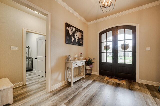 1715 Sylar Cir, Conway, AR 72034 - entryway featuring arched walkways, wood finished floors, french doors, ornamental molding, and baseboards