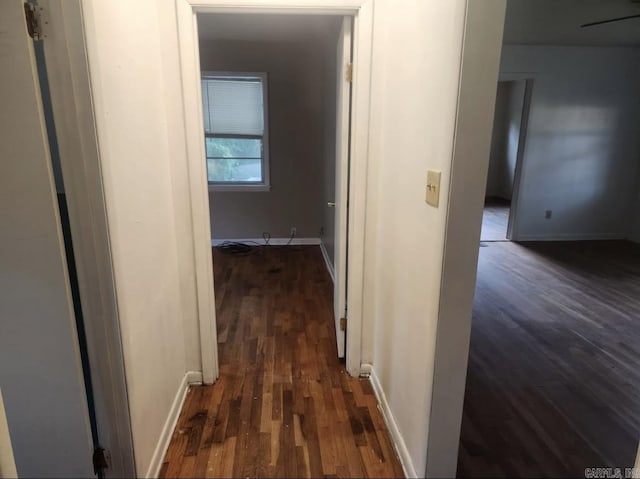 104 W Searcy, Searcy, AR 72082 - hallway featuring dark wood-style flooring and baseboards