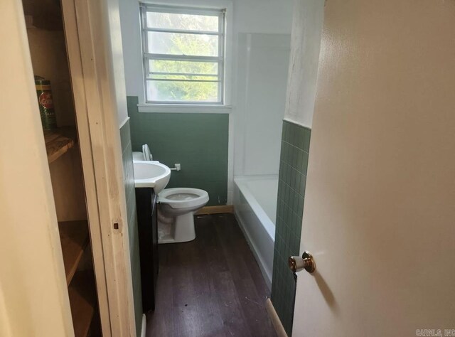 104 W Searcy, Searcy, AR 72082 - bathroom featuring toilet, wood finished floors, vanity, a tub, and a shower