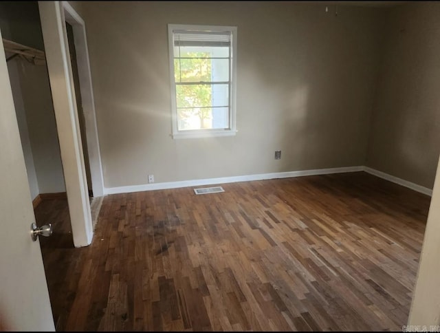 104 W Searcy, Searcy, AR 72082 - unfurnished bedroom featuring wood finished floors and baseboards