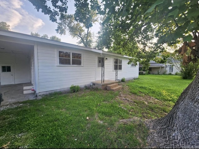 104 W Searcy, Searcy, AR 72082 - back of house with a lawn